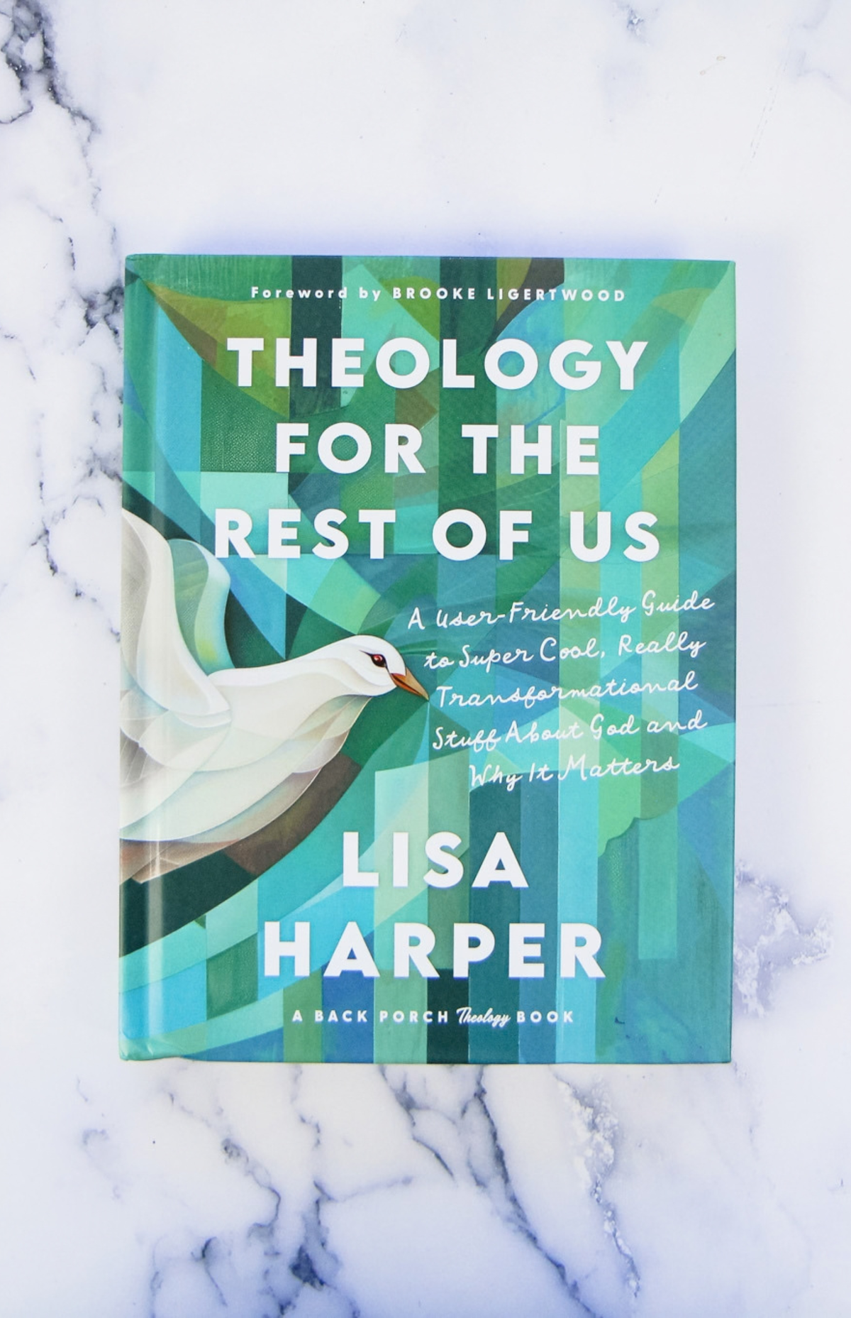Cover of "Theology for the Rest of Us" on a marble countertop.