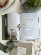 An image of the interior of House Hushing, featuring a chapter titled "Simplicity for the Beauty Obsessed."