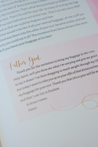 A close-up view of an interior page of "Pray Anyway". In the image, a text box contains a prayer that associates with the chapter.